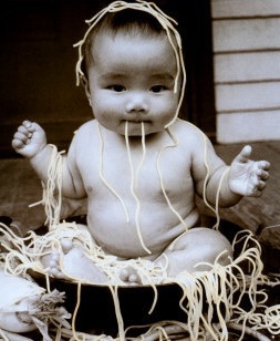 child in noodles