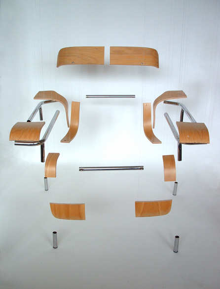 [photo of a sawn up chair, parts freely separated]